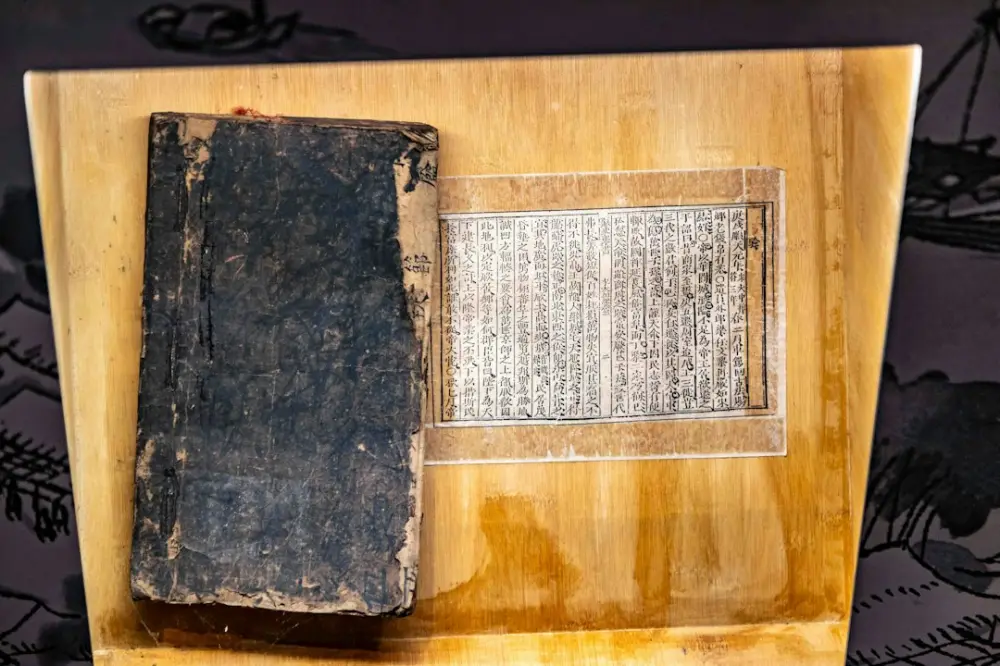 An old book and ancient manuscript on display, illustrating myth and narrative in contemporary indian literature
